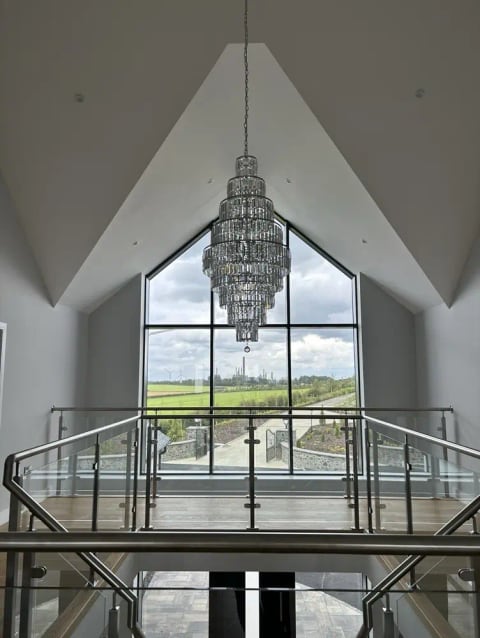 Tall-windowed room with a chandelier